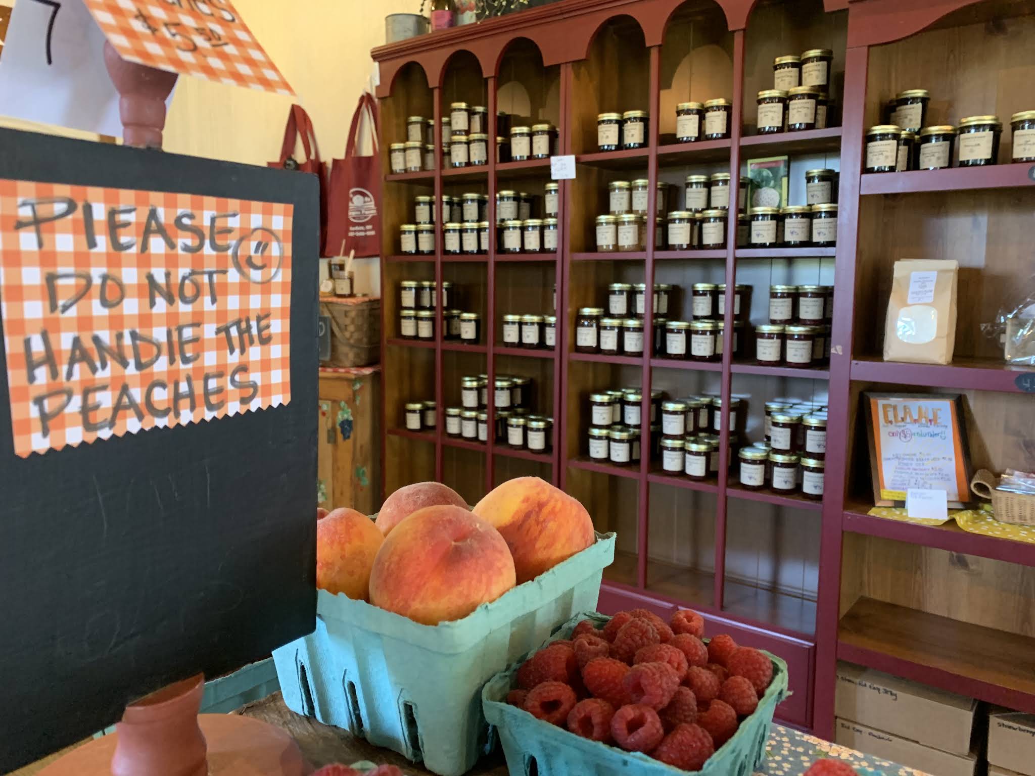 Farm shop interior showing fruit and jams.